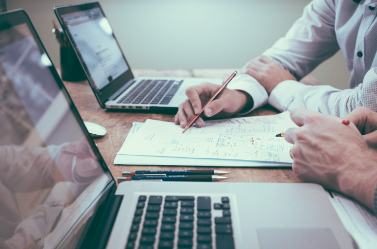 Business executives review sales data to create a sales optimization plan